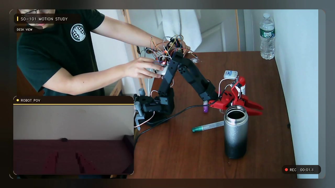 SO-101 physical-arm teleoperation motion study with a robot-mounted camera feed.